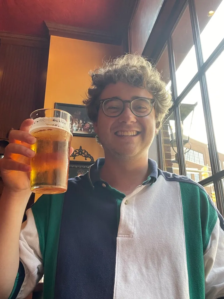Adam raising a pint